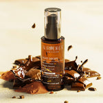 Sérum Light Drops posé sur du chocolat – Chogan – soin cheveux bruns